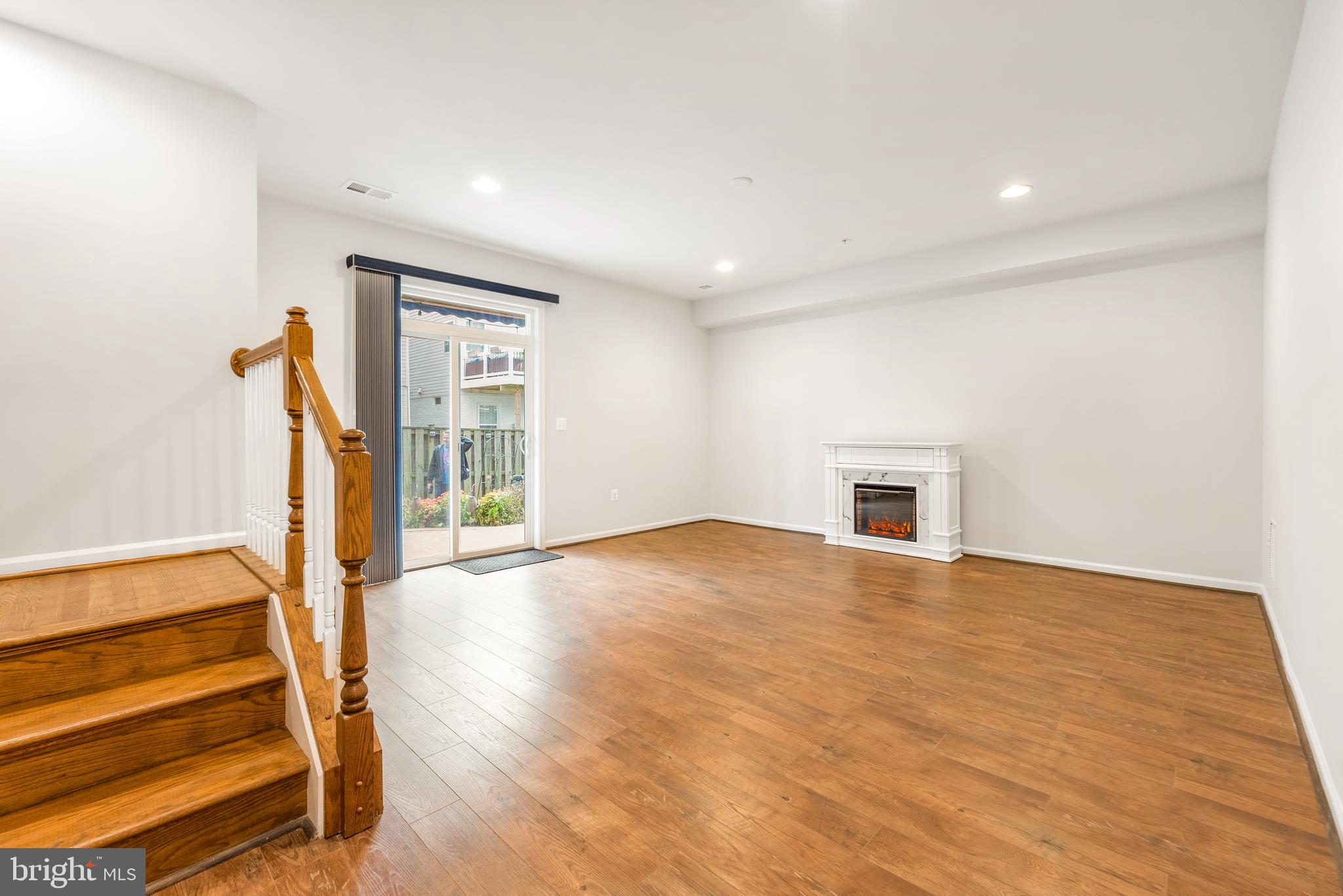 3510 Landing Way Silver Spring, MD 20906 - Photo 5 of 47 a view of an empty room with wooden floor and a window