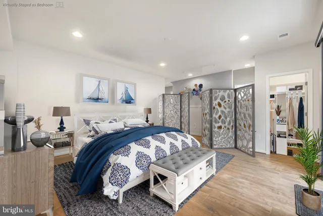 a bedroom with a bed and a couch