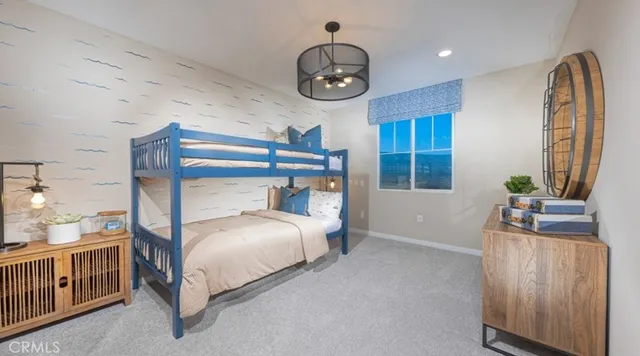 a living room with furniture a chandelier and a flat screen tv