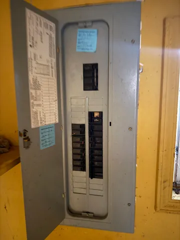 a living room with furniture a flat screen tv and a table