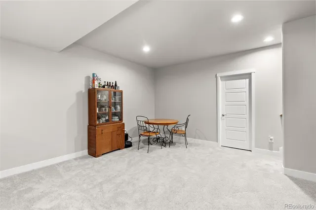 an empty room with furniture and a table