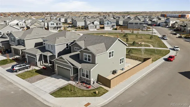 an aerial view of a house with a swimming pool
