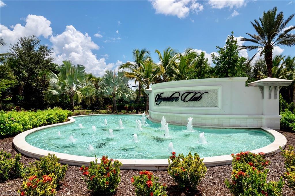 8008 Signature Club Circle Naples, FL 34113 - Photo 1 of 30 a view of a swimming pool with a yard
