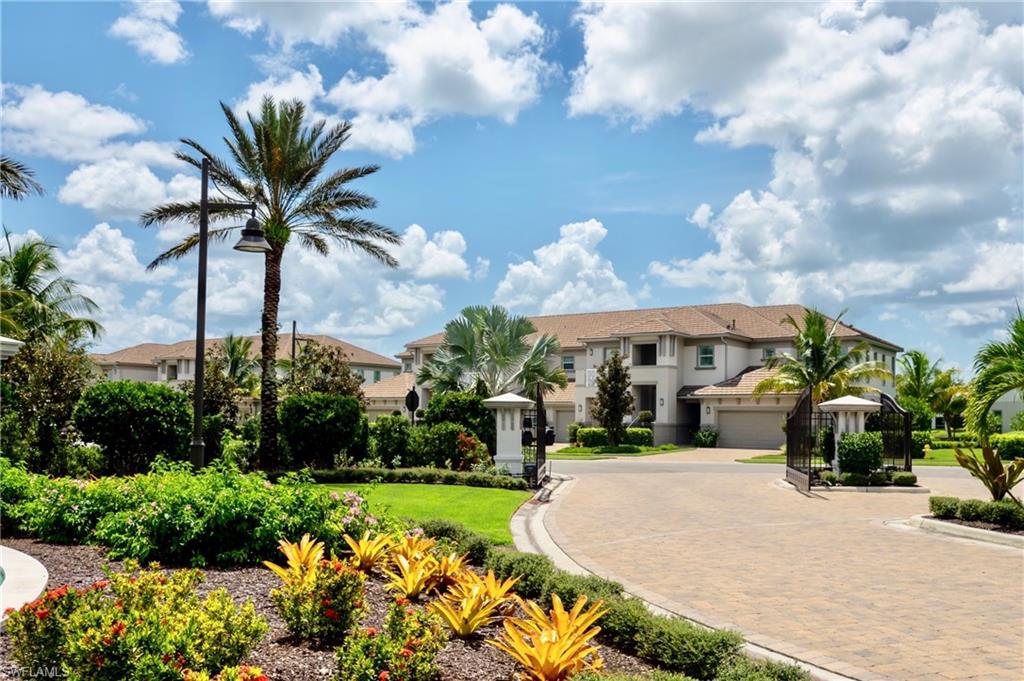 8008 Signature Club Circle Naples, FL 34113 - Photo 2 of 30 a view of a house with a yard and potted plants