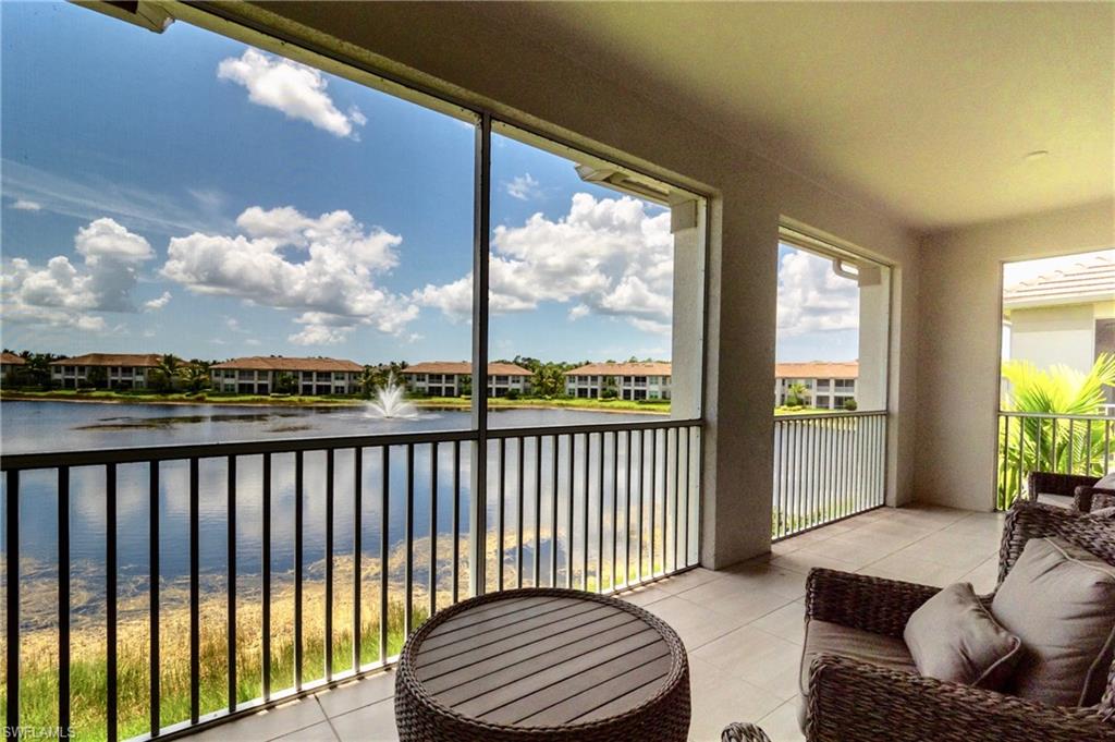 8008 Signature Club Circle Naples, FL 34113 - Photo 22 of 30 a balcony with furniture