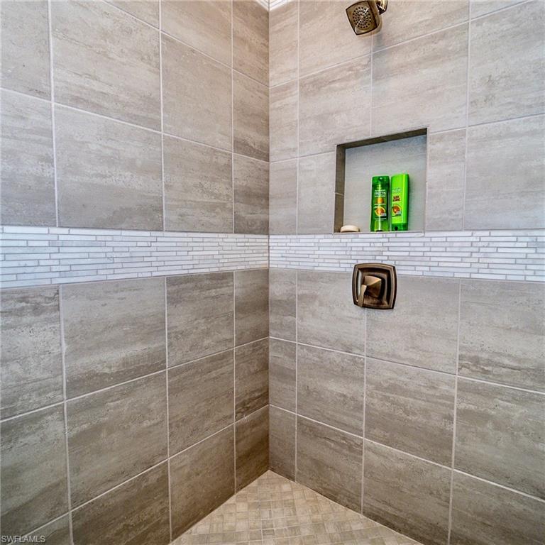 8008 Signature Club Circle Naples, FL 34113 - Photo 28 of 30 a bathroom with a shower