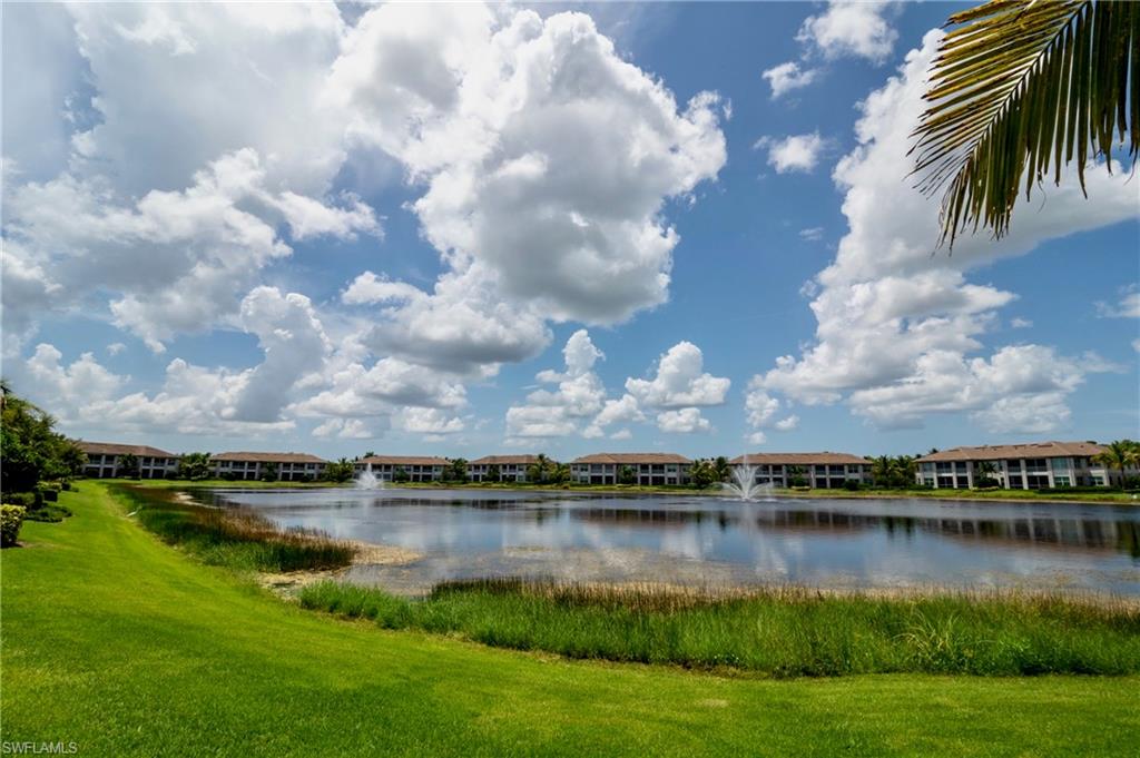 8008 Signature Club Circle Naples, FL 34113 - Photo 30 of 30 a view of a lake in middle of forest