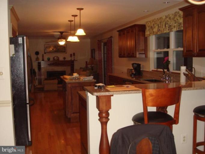 311 Whitaker Mill Road Fallston, MD 21047 - Photo 2 of 28 a kitchen with kitchen island granite countertop furniture a sink and a refrigerator