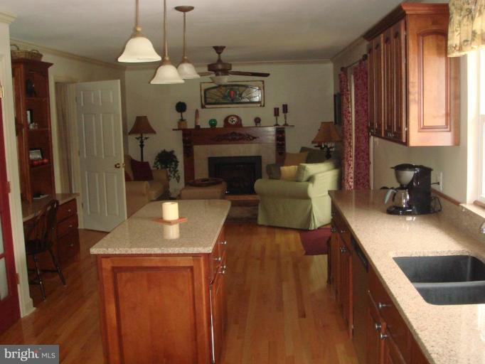 311 Whitaker Mill Road Fallston, MD 21047 - Photo 12 of 28 a kitchen with furniture a counter top space a sink and a refrigerator
