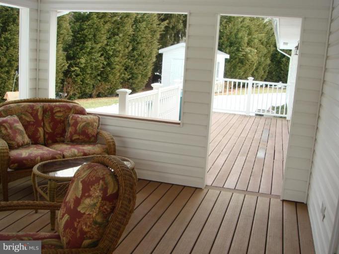 311 Whitaker Mill Road Fallston, MD 21047 - Photo 16 of 28 a view of a balcony with furniture and wooden floor