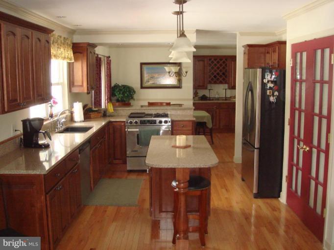 311 Whitaker Mill Road Fallston, MD 21047 - Photo 19 of 28 a kitchen with a sink stove and refrigerator