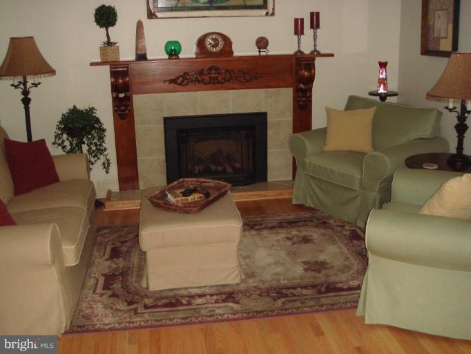 311 Whitaker Mill Road Fallston, MD 21047 - Photo 23 of 28 a living room with furniture and a fireplace