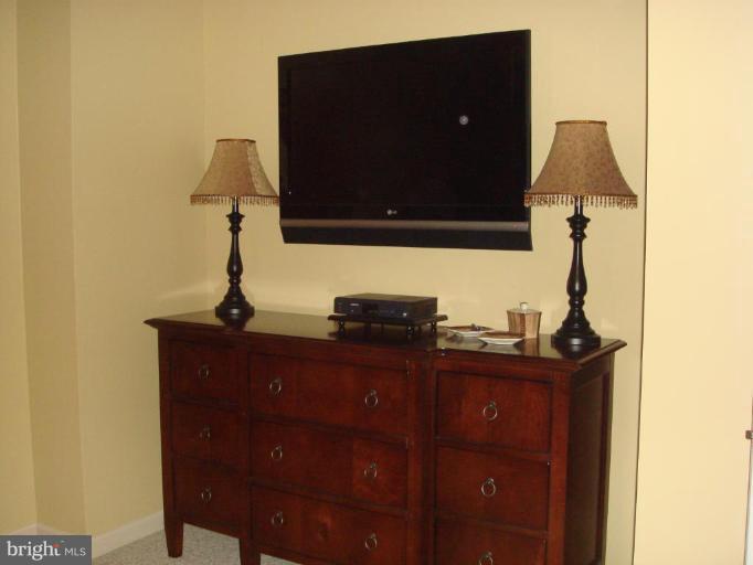 311 Whitaker Mill Road Fallston, MD 21047 - Photo 6 of 28 a living room with a lamp and a flat screen tv