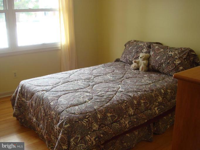 311 Whitaker Mill Road Fallston, MD 21047 - Photo 9 of 28 a bed sitting in a bedroom next to a window