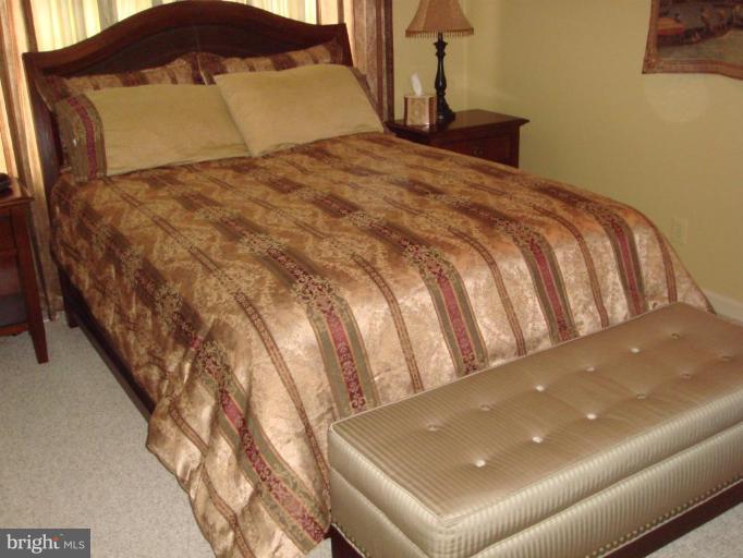 311 Whitaker Mill Road Fallston, MD 21047 - Photo 10 of 28 a bedroom with a bed and a night stand