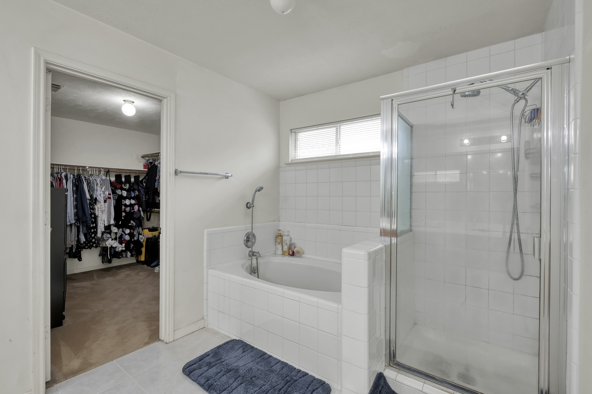 2539 Forge Creek Road Houston, TX 77067 - Photo 19 of 40 The primary bathroom features a soaking tub, separate shower, and spacious walk-in closet.