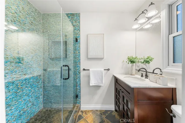 a bathroom with a sink and mirror