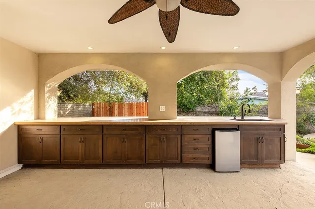 a bathroom with a sink and large window