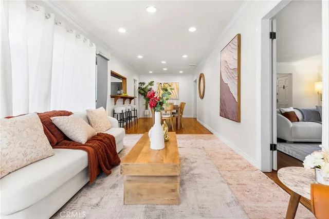 a living room with furniture and a large mirror