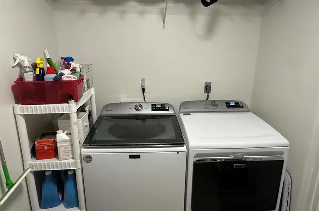a utility room with dryer and washer