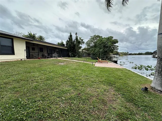 a backyard of a house with lots of green space