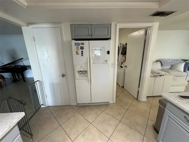a view of a kitchen from the hallway