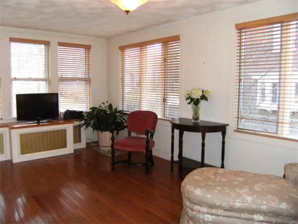 41 Prentice Road Newton, MA 02459 - Photo 11 of 28 a living room with furniture and a flat screen tv