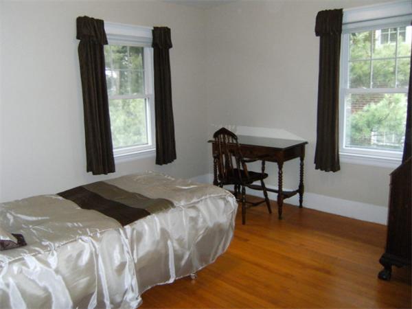 41 Prentice Road Newton, MA 02459 - Photo 20 of 28 a bedroom with a bed and a window