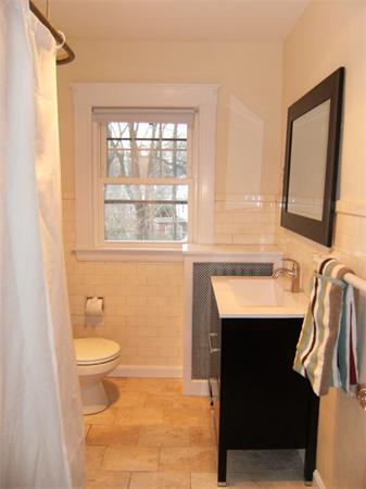 41 Prentice Road Newton, MA 02459 - Photo 21 of 28 a bathroom with a sink a toilet a mirror and a window
