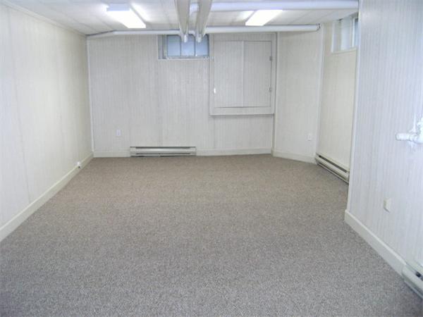 41 Prentice Road Newton, MA 02459 - Photo 26 of 28 an empty room with chandelier fan