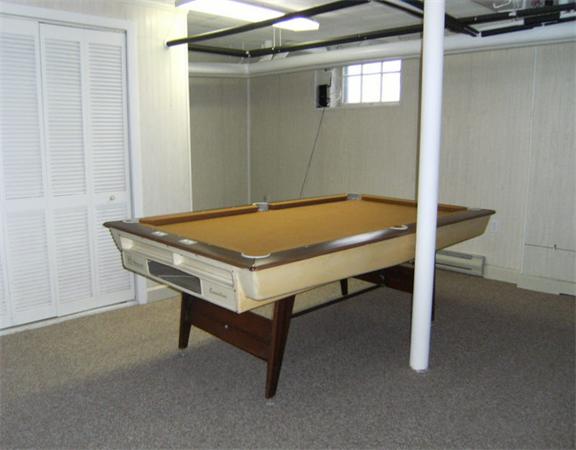 41 Prentice Road Newton, MA 02459 - Photo 27 of 28 a room with a table and bed