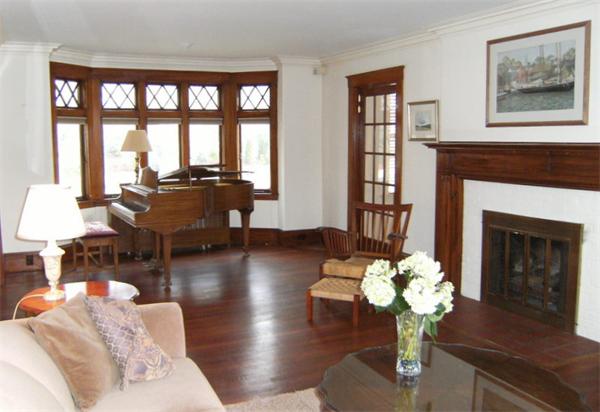 41 Prentice Road Newton, MA 02459 - Photo 4 of 28 a living room with furniture fireplace and a large window