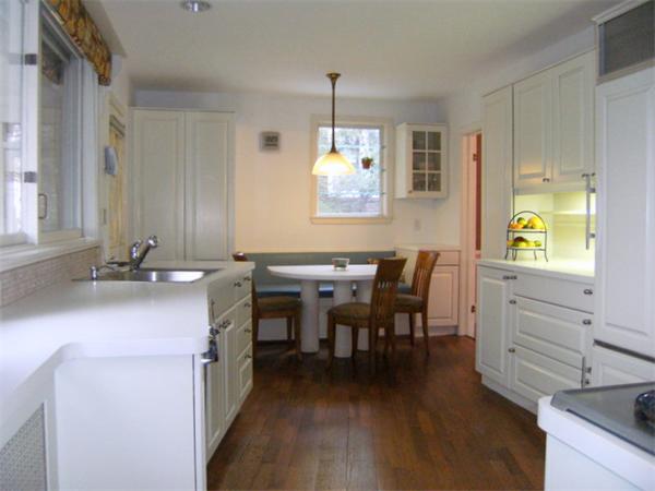 41 Prentice Road Newton, MA 02459 - Photo 6 of 28 a kitchen with sink cabinets and dining table