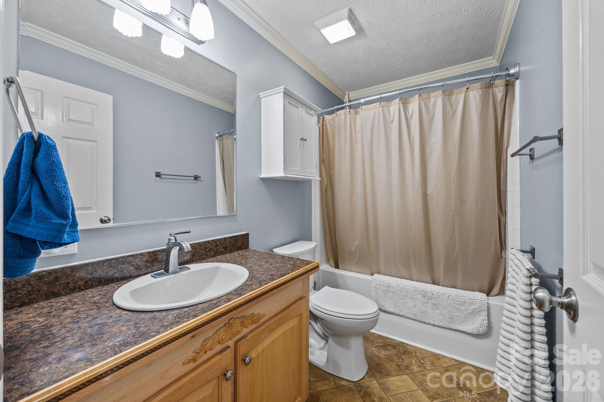 19807 Alpine Road Albemarle, NC 28001 - Photo 20 of 40 a bathroom with a granite countertop sink and a mirror