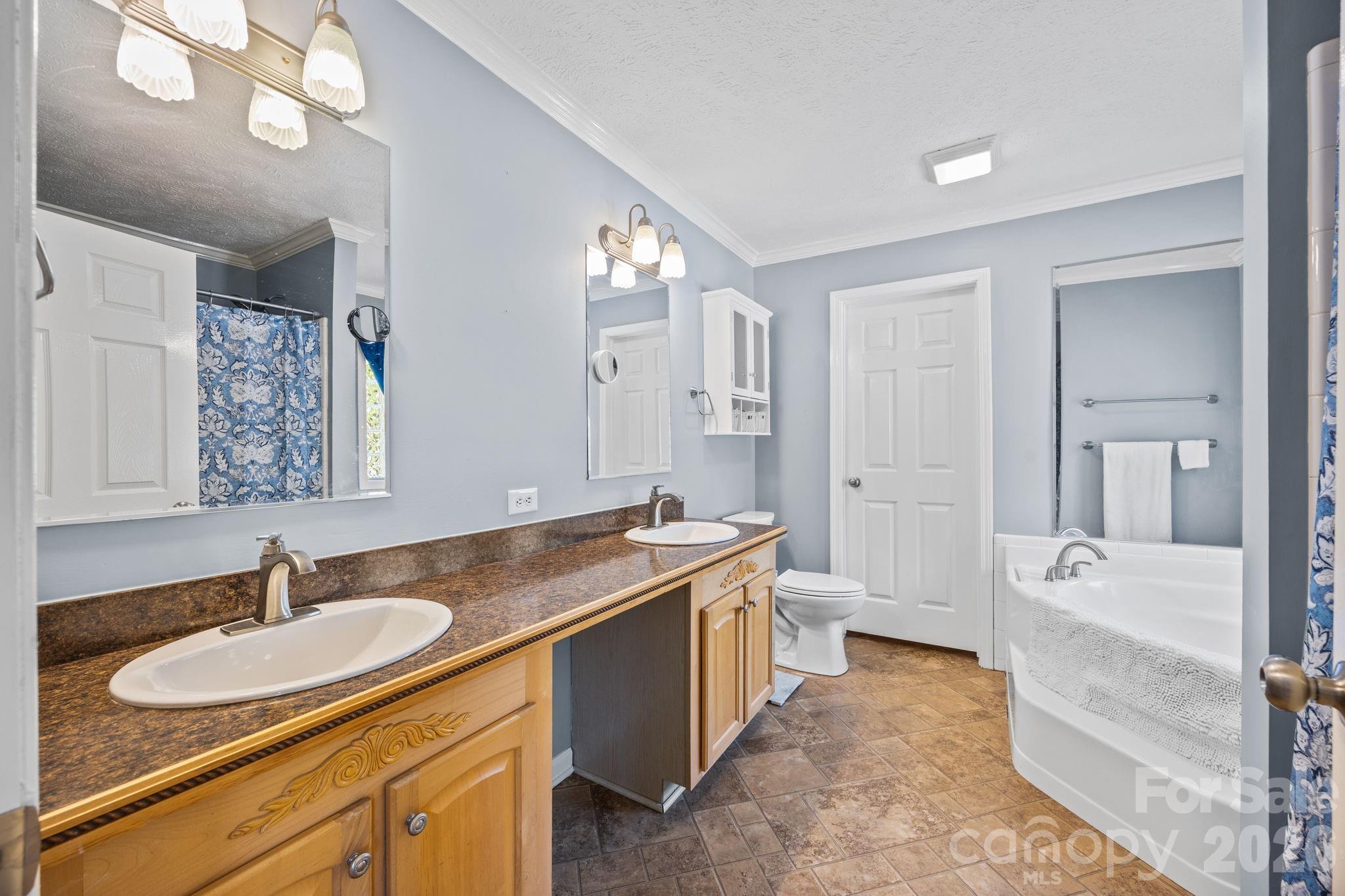 19807 Alpine Road Albemarle, NC 28001 - Photo 24 of 40 a bathroom with a granite countertop sink and a mirror
