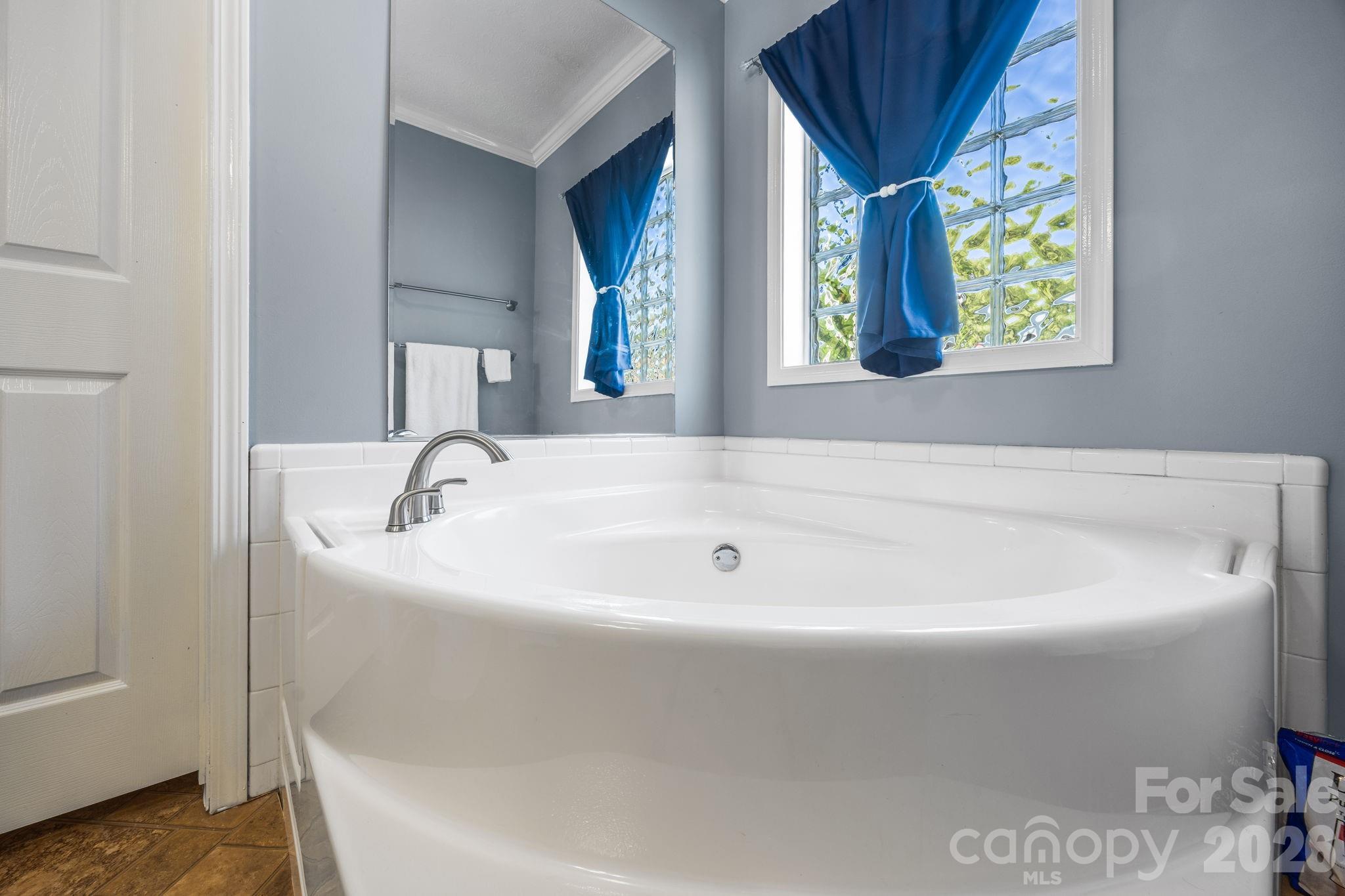 19807 Alpine Road Albemarle, NC 28001 - Photo 25 of 40 a white bath tub sitting in a bathroom
