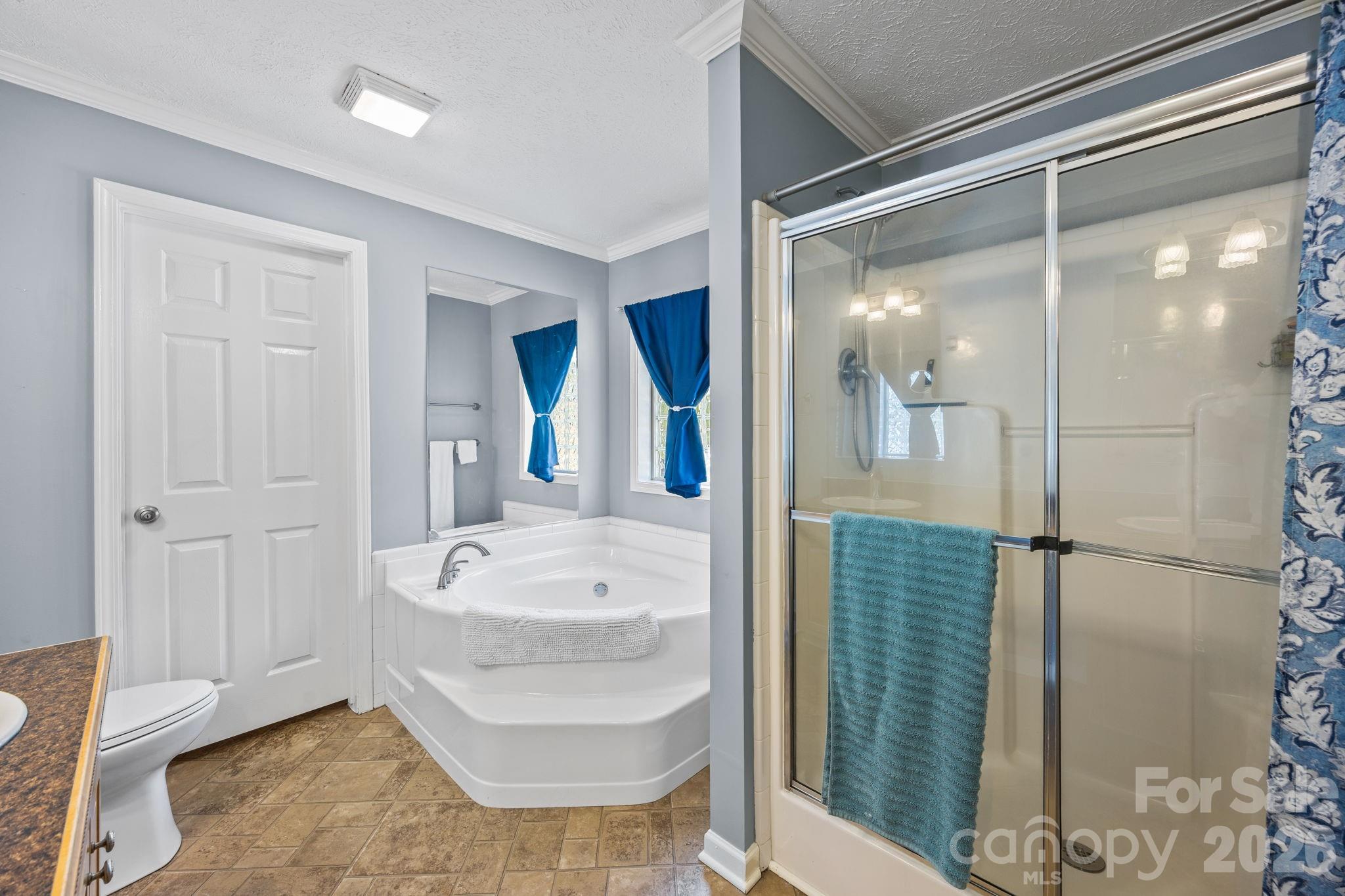 19807 Alpine Road Albemarle, NC 28001 - Photo 26 of 40 a bathroom with a bathtub sink and mirror