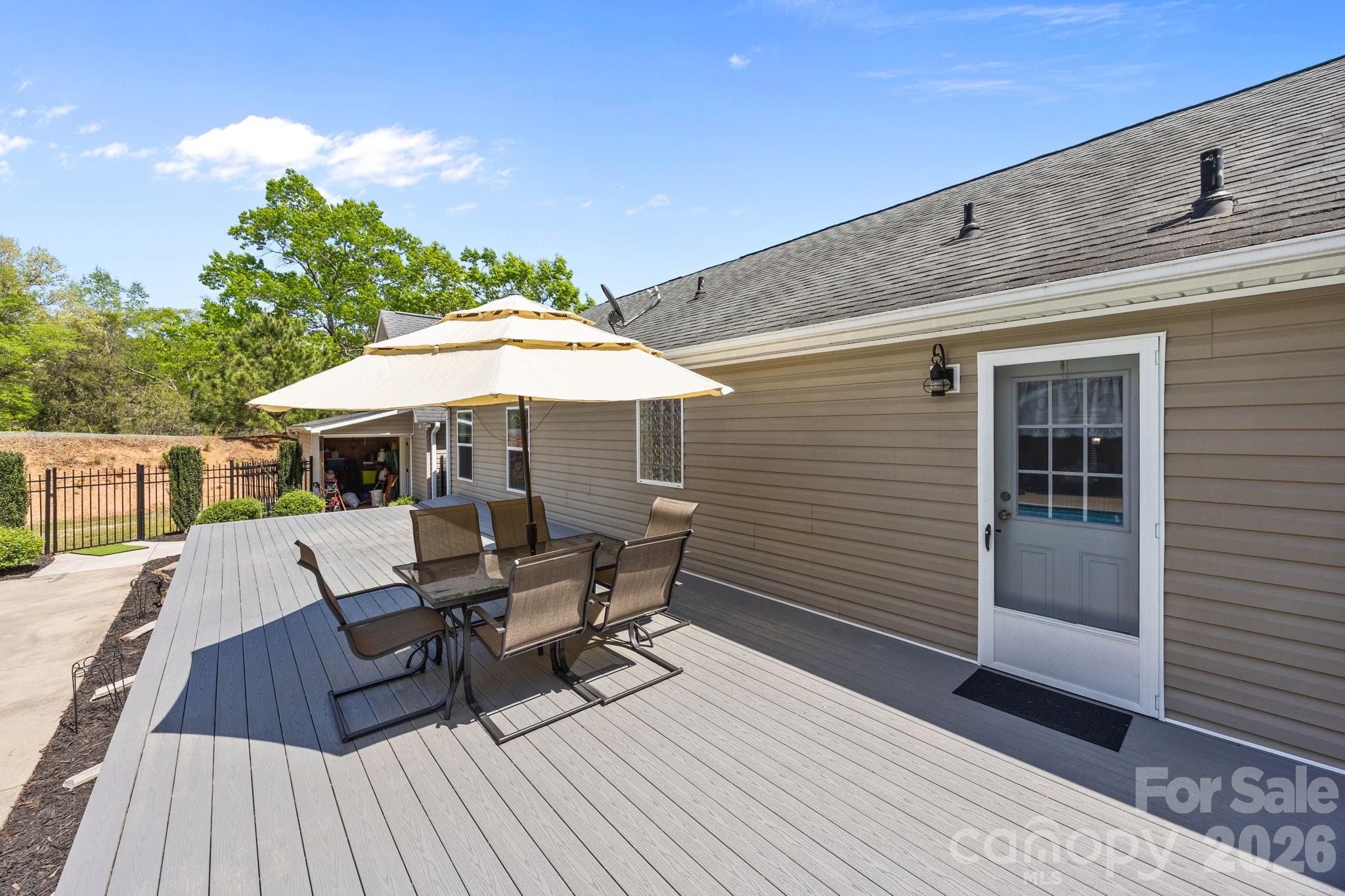 19807 Alpine Road Albemarle, NC 28001 - Photo 34 of 40 a patio with table and chairs