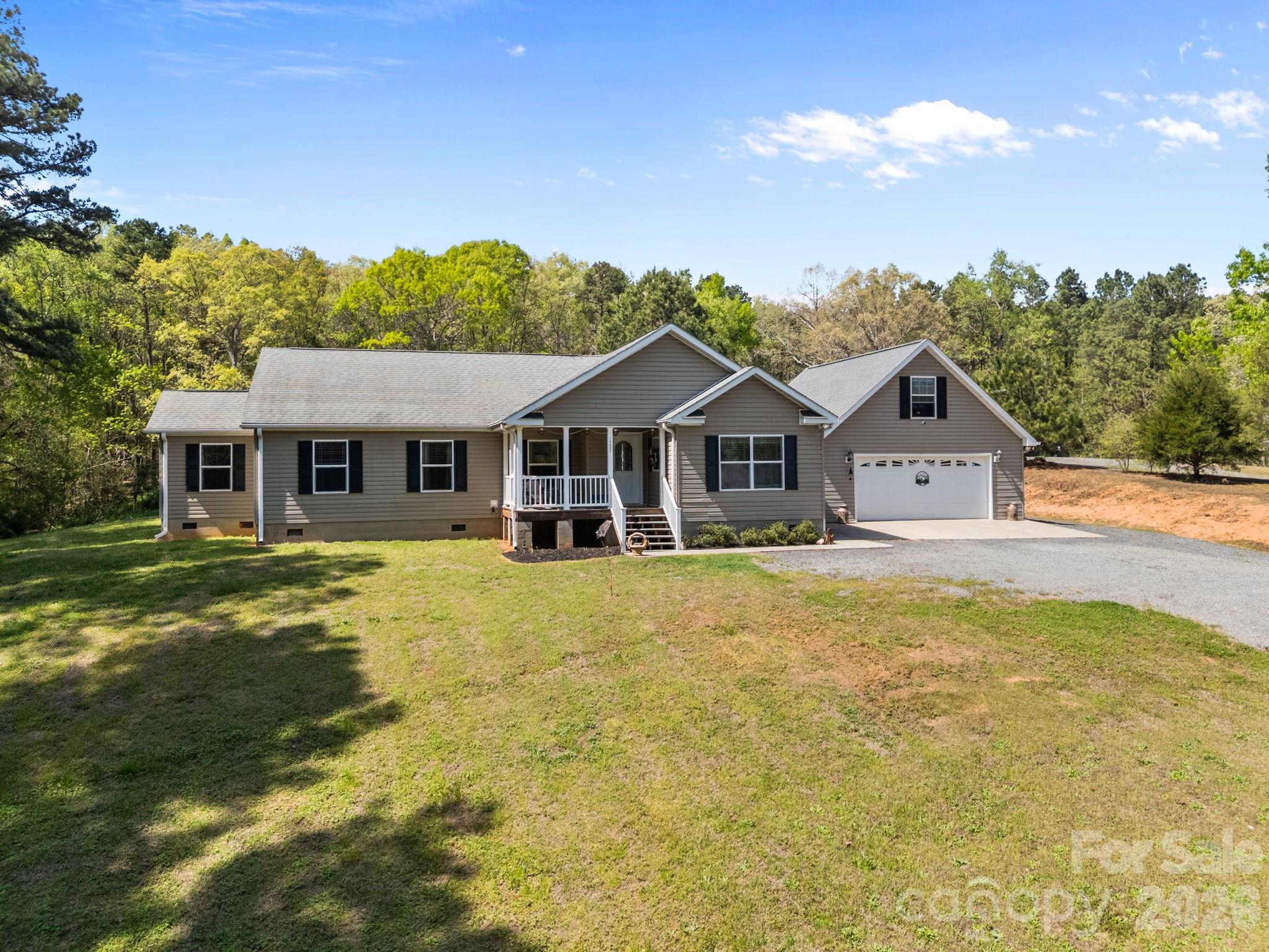 19807 Alpine Road Albemarle, NC 28001 - Photo 36 of 40 a front view of a house with yard and green space