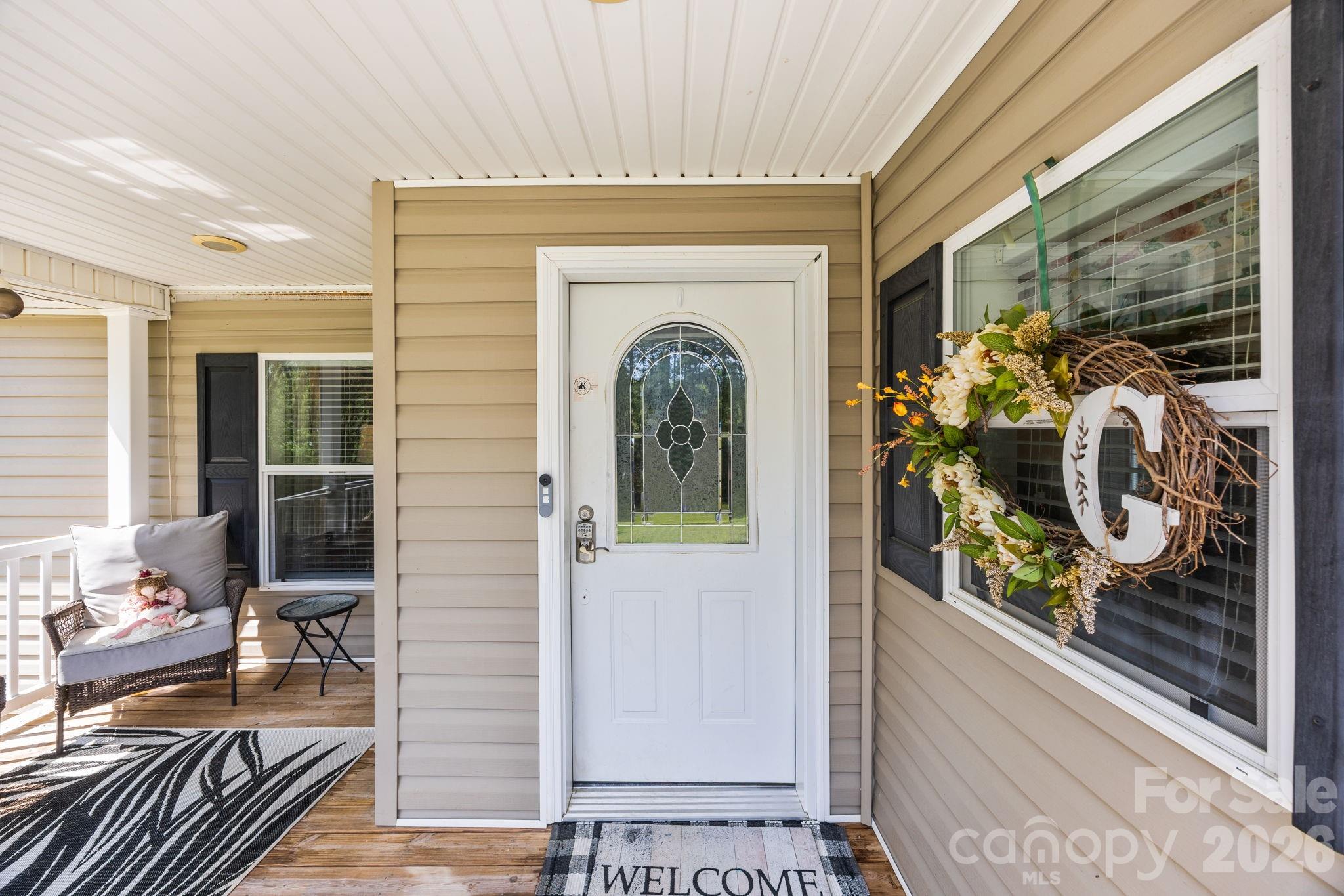 19807 Alpine Road Albemarle, NC 28001 - Photo 5 of 40 a view of a entryway door of the house