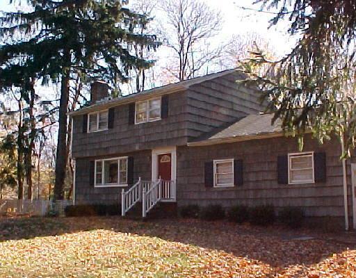 339 Barrack Hill Road Ridgefield, CT 06877 - Photo 1 of 1 a backyard of a house with barbeque oven and large trees