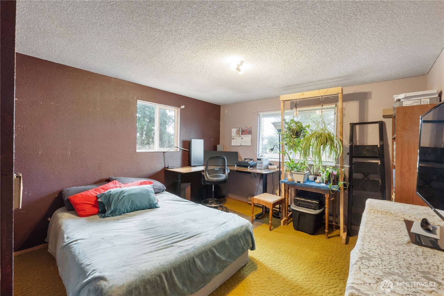 29621 Webster Road East Graham, WA 98338 - Photo 17 of 35 a bedroom with a bed a couch and dresser