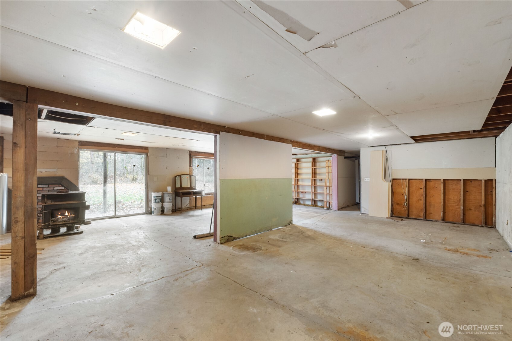29621 Webster Road East Graham, WA 98338 - Photo 19 of 35 a view of a livingroom with a car parked in the patio