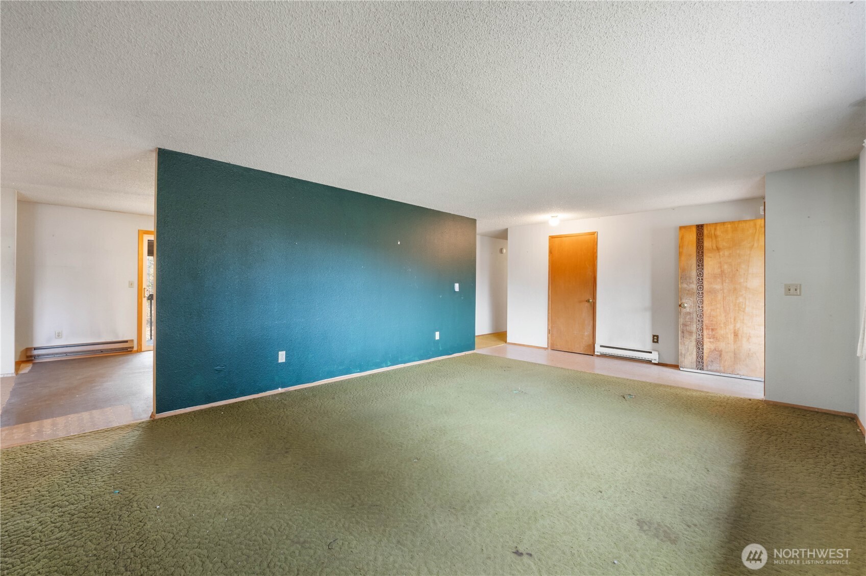 29621 Webster Road East Graham, WA 98338 - Photo 8 of 35 an empty room with windows and city view