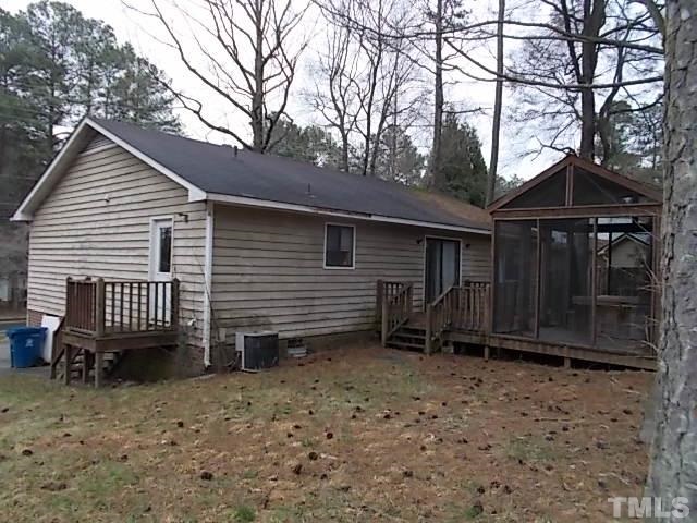 831 Horton Road Durham, NC 27704 - Photo 2 of 8 a view of a house with a yard and wooden fence