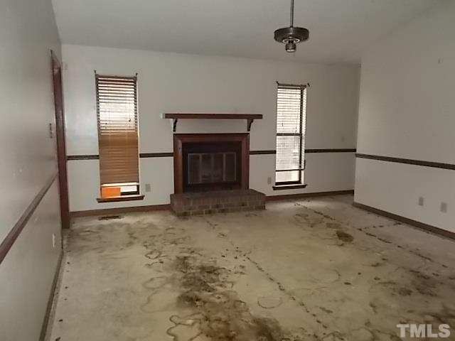 831 Horton Road Durham, NC 27704 - Photo 5 of 8 a view of a livingroom with a fireplace