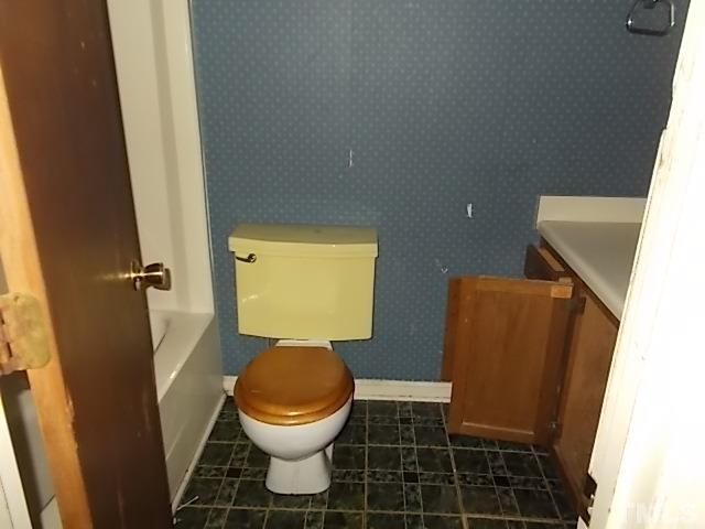 831 Horton Road Durham, NC 27704 - Photo 8 of 8 a bathroom with a toilet and a shower