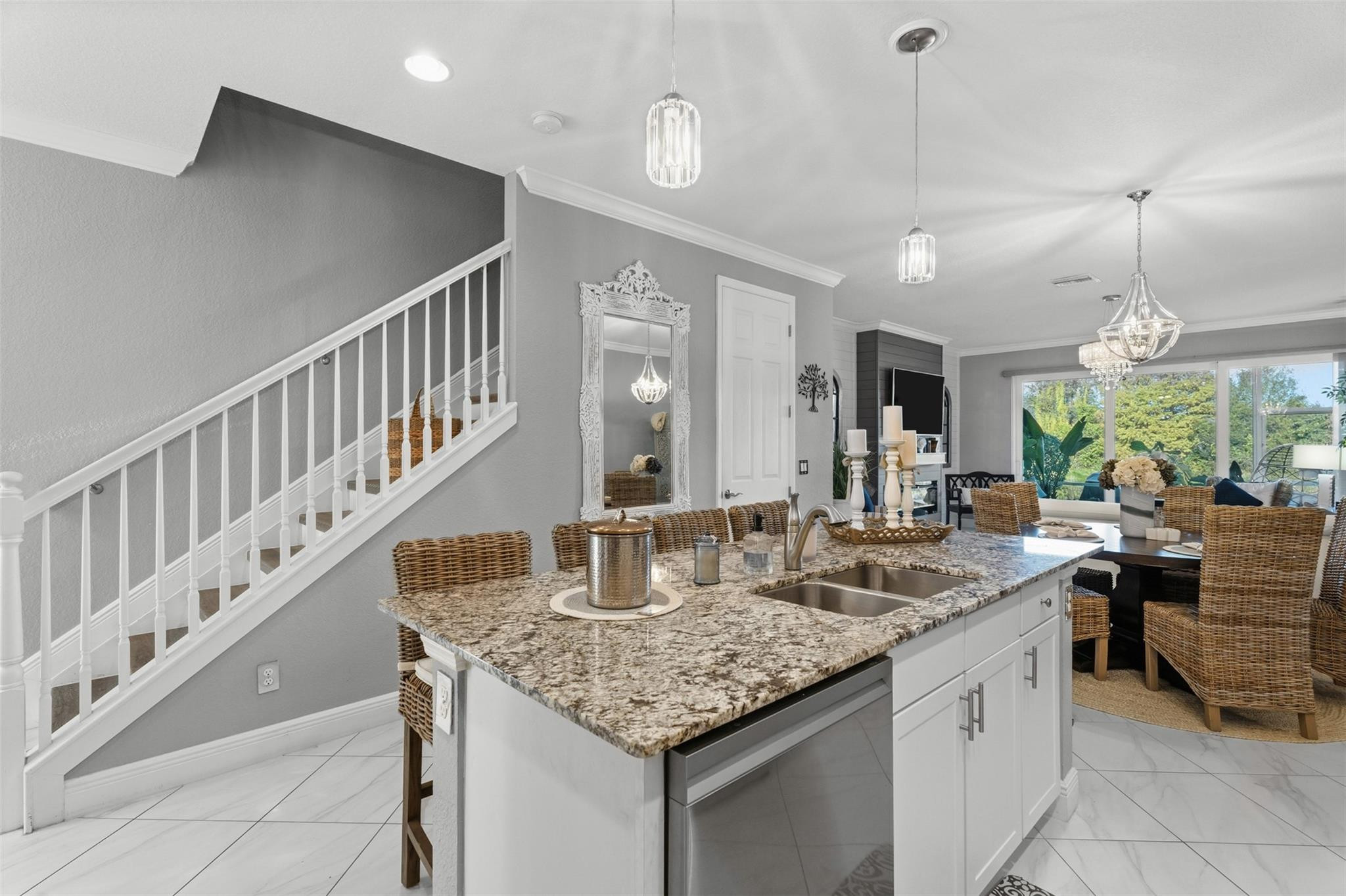 651 Southwest Glen Crest Way, Unit 2 Stuart, FL 34997 - Photo 9 of 41 a kitchen with sink island and view living room