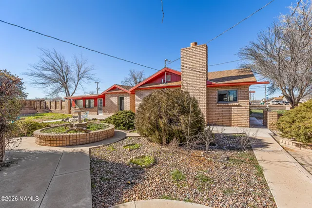 a kitchen with stainless steel appliances granite countertop a sink a stove and oven