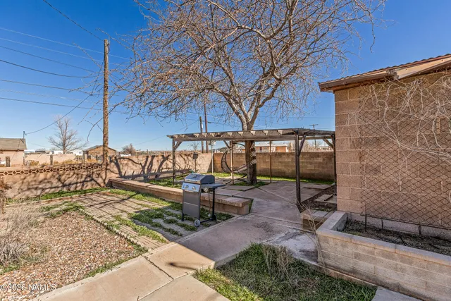 a bedroom with a beds and painting on the wall